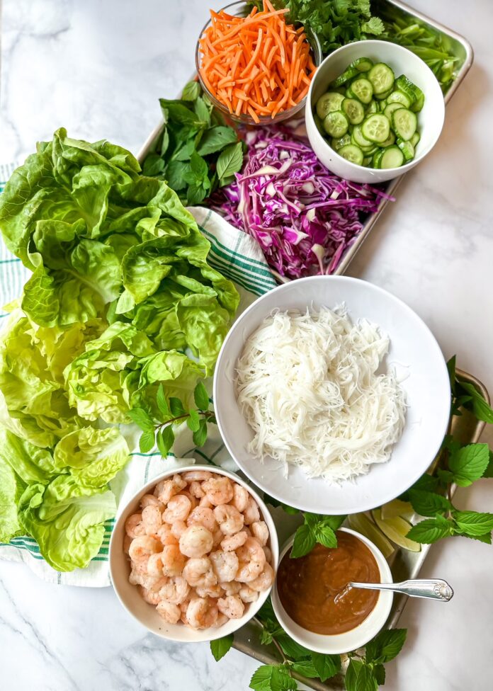 sheet pan with ingredients to assemble summer roll lettuce wraps